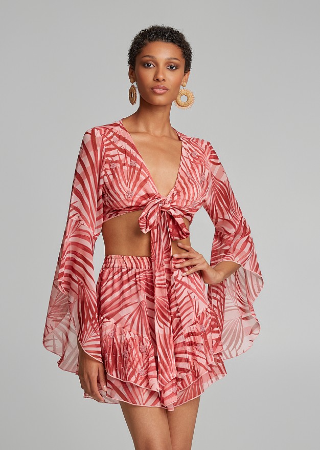 Printed top with a tie and bell sleeves
