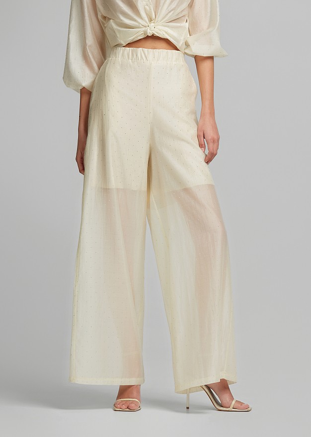 Sheer trousers with sparkling rhinestone embellishments