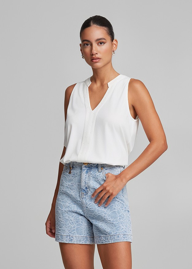 Top with a cut-out  and V neckline