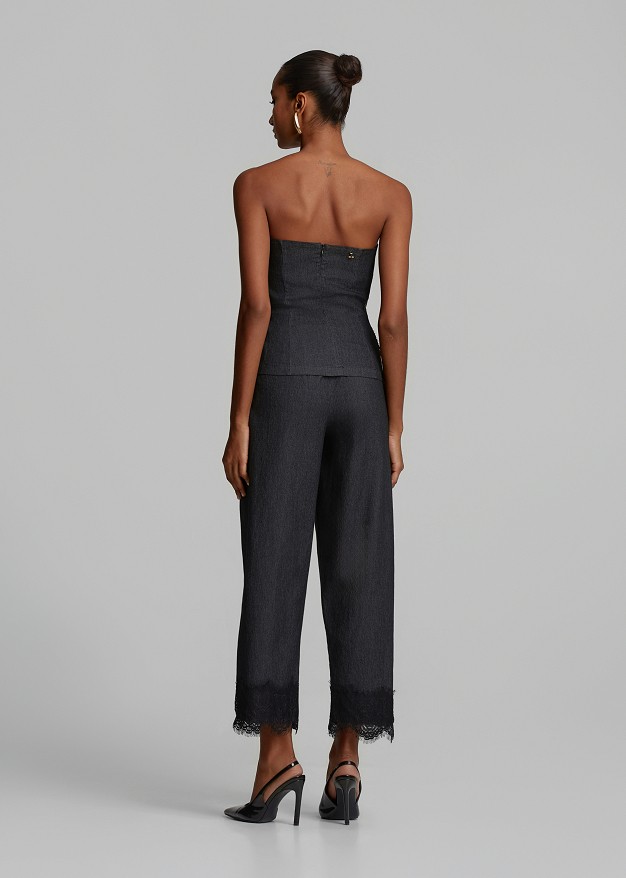 Trousers in soft denim and decorative lace hem