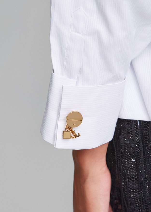 Fitted asymmetric shirt with peplum