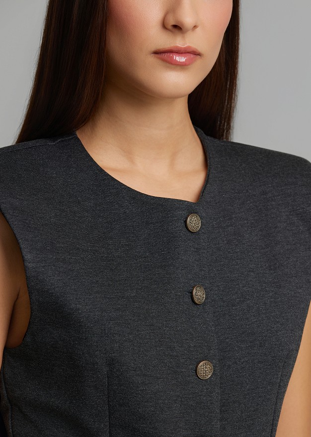 Peplum vest with structured shoulders