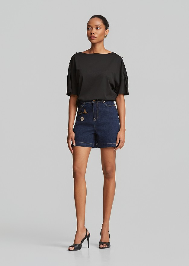 Denim shorts in statement pins