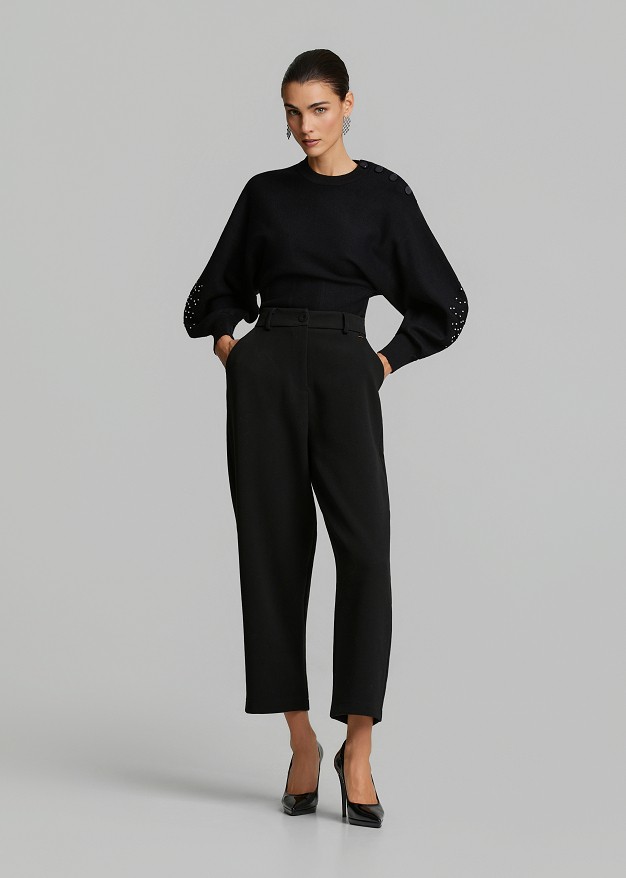 Sweater paired with a waist corset