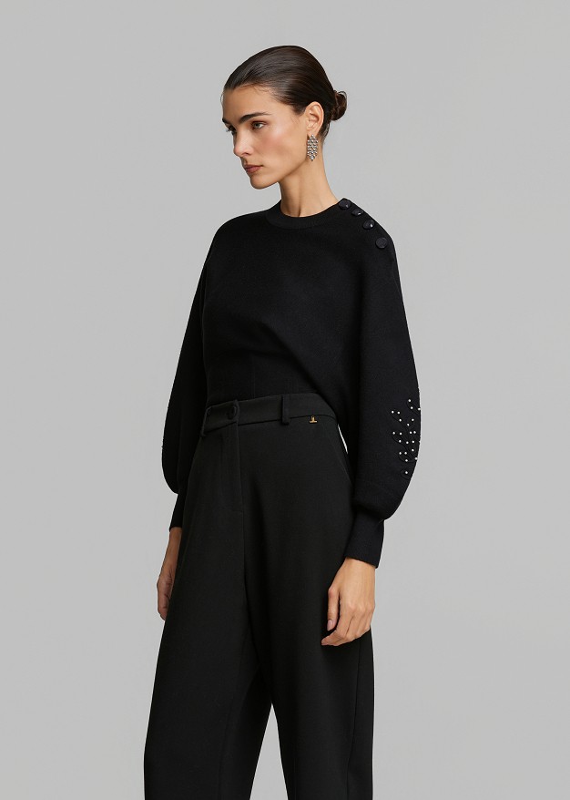 Sweater paired with a waist corset