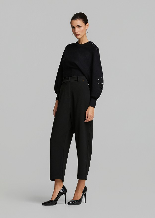 Sweater paired with a waist corset