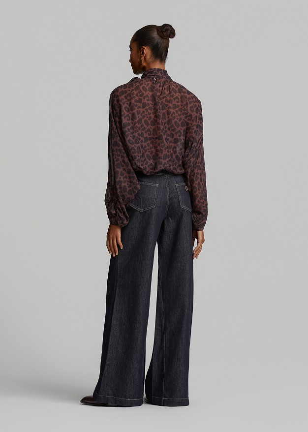 Oversized sheer leopard-print top with a tie-neck