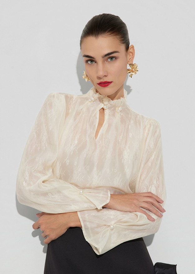 High-neck blouse with an internal lace lining