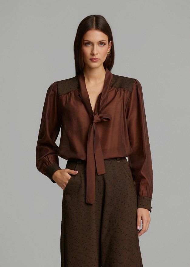 Sheer blouse featuring polka-dot details