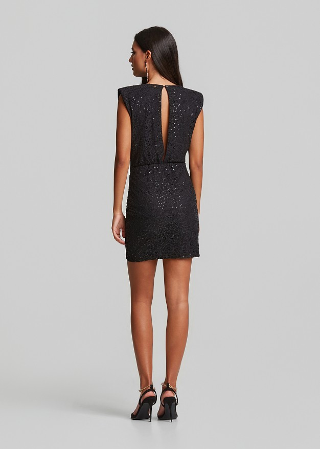 Lace mini dress in sequins and bold shoulders