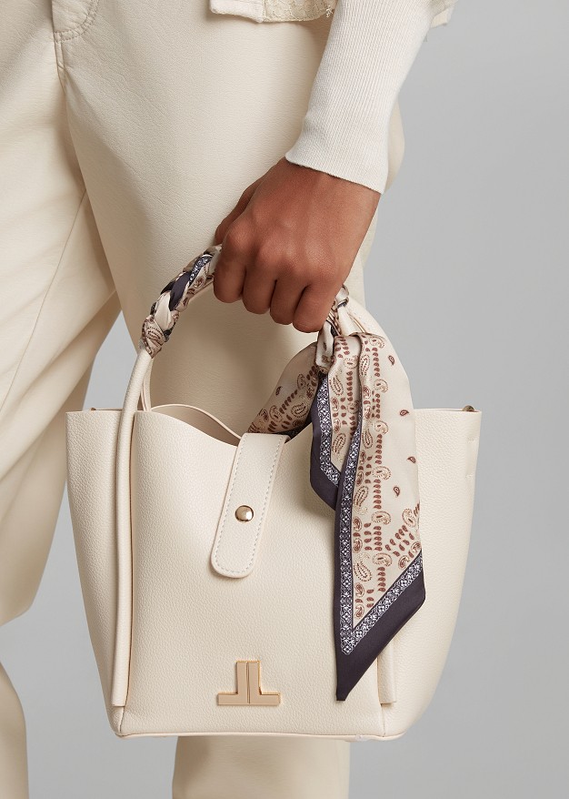 Handbag with a decorative scarf