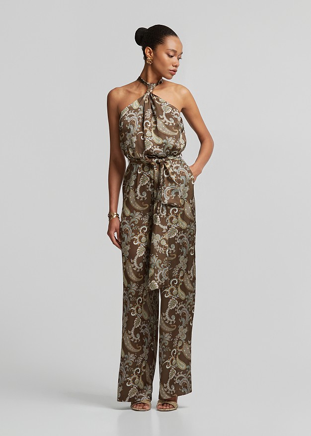 Printed halter-neck jumpsuit with a metallic detail