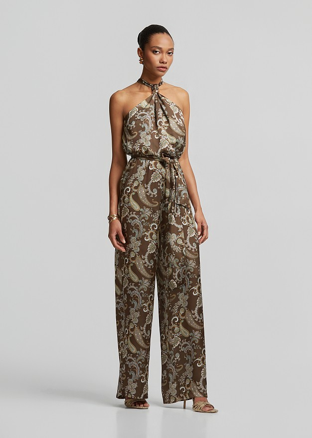 Printed halter-neck jumpsuit with a metallic detail