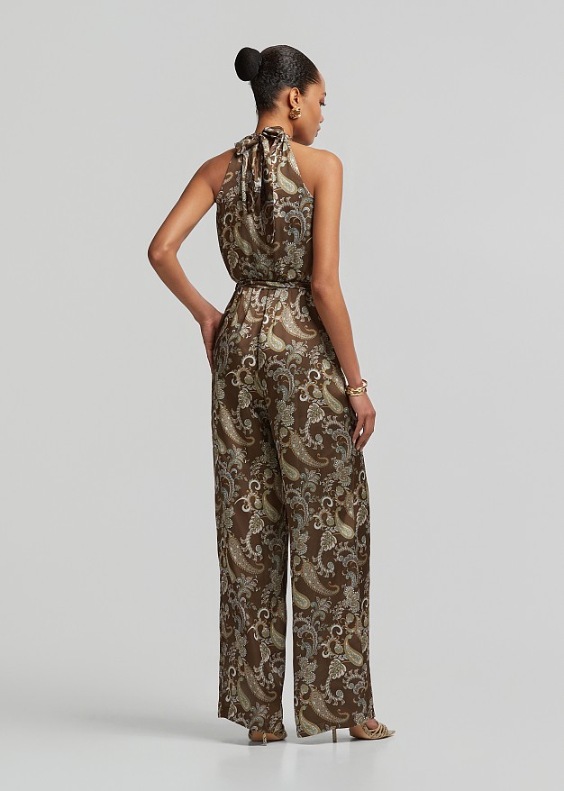 Printed halter-neck jumpsuit with a metallic detail