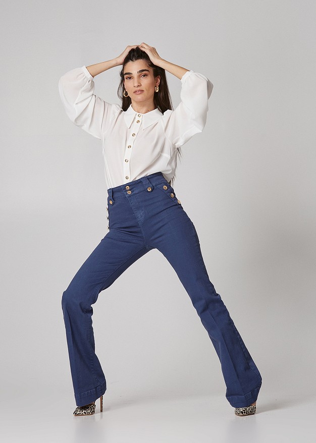 Denim flared trousers with decorative buttons