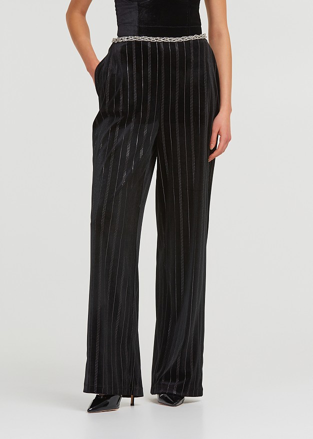 Pants in velvet look with strass stripes