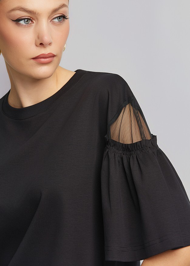 Blouse with sheer detail on the sleeves