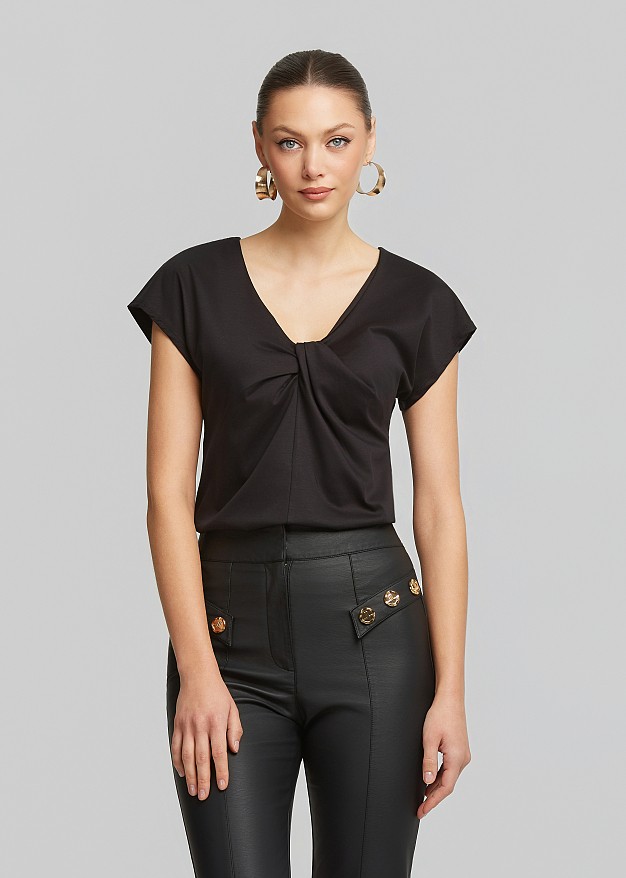 Solid-color blouse with knot
