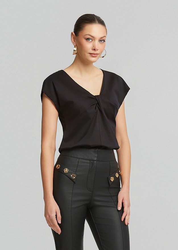 Solid-color blouse with knot