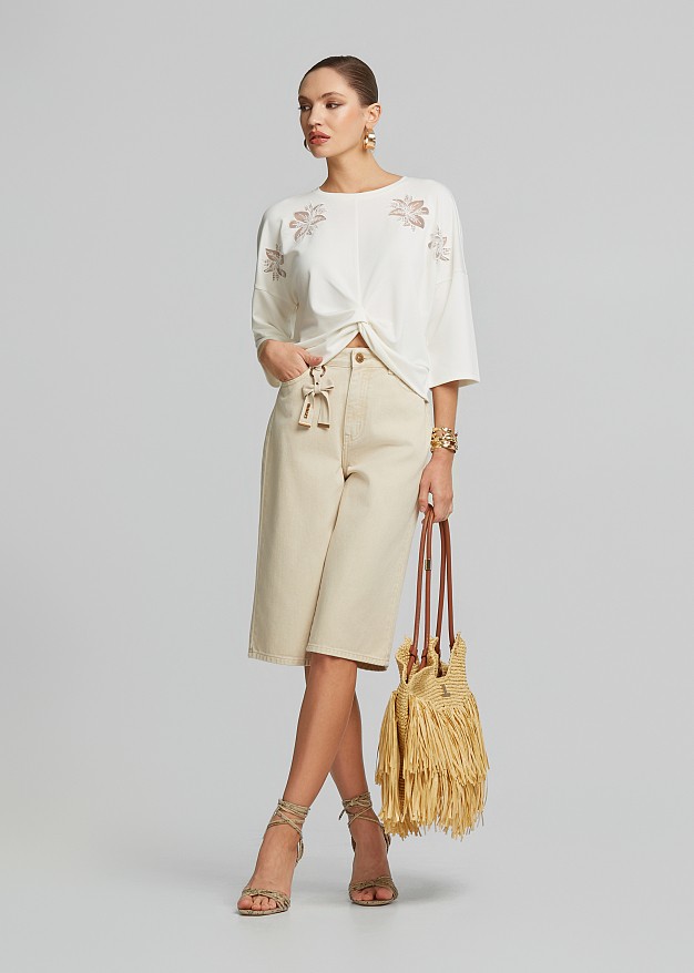 Blouse with sheer details