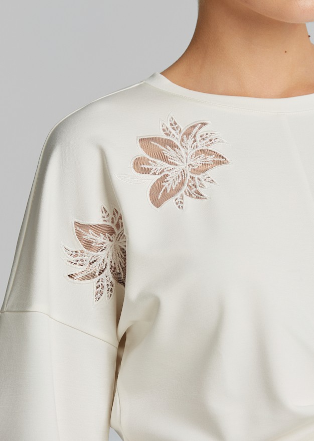 Blouse with sheer details