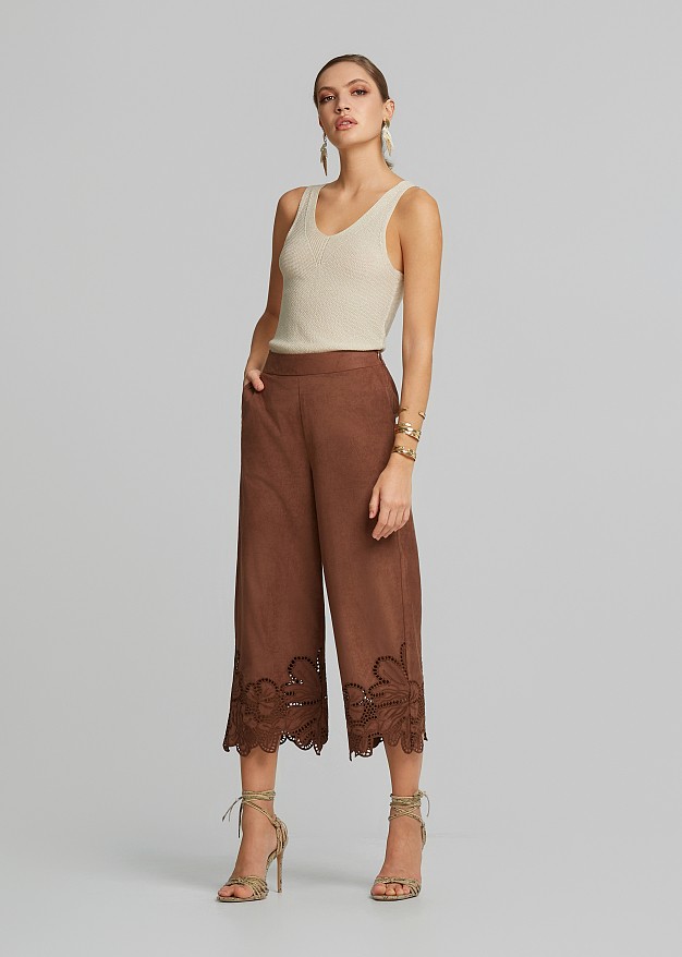 Soft suede-look finish pants and laser-cut accents