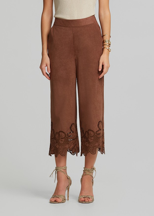 Soft suede-look finish pants and laser-cut accents