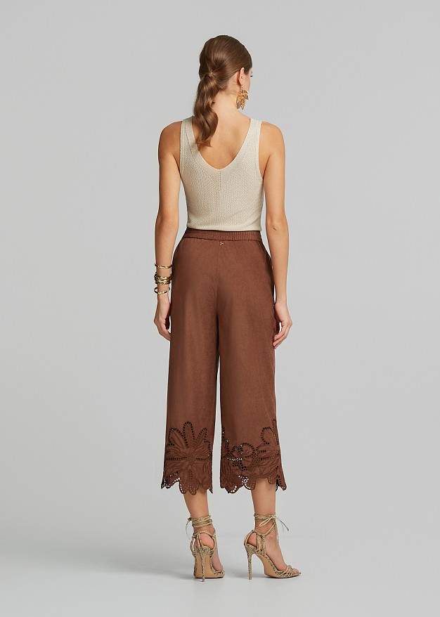 Soft suede-look finish pants and laser-cut accents