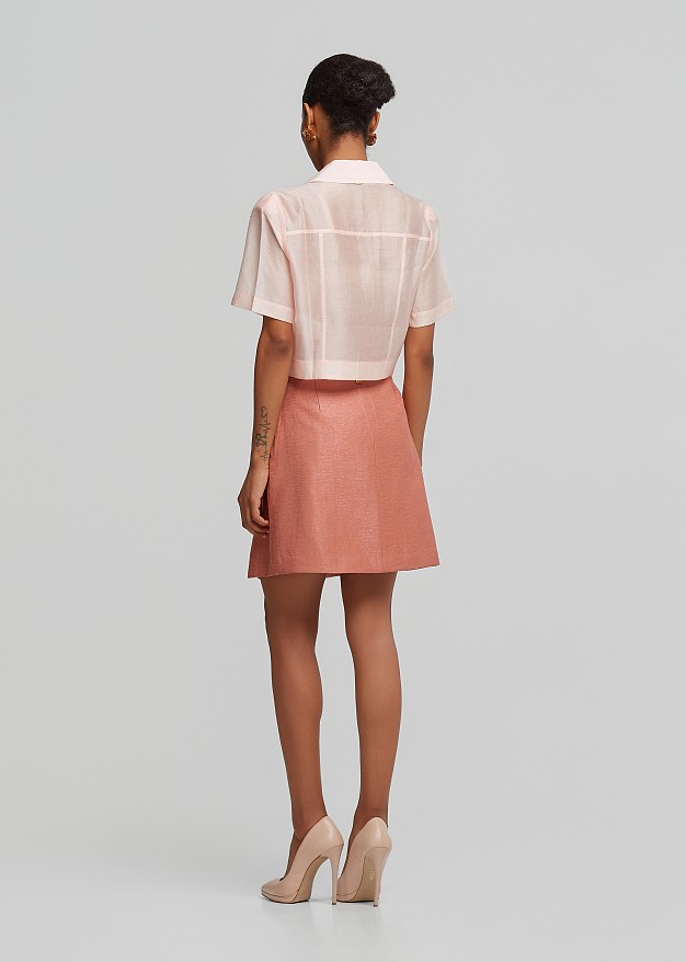 Pleated mini skirt with a silky finish