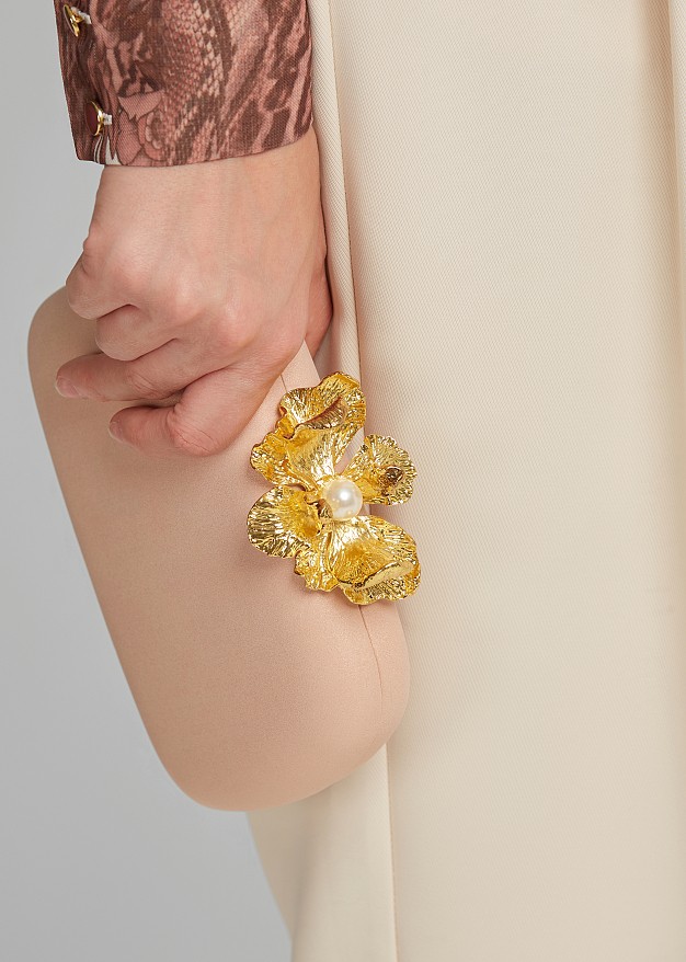 Clutch bag in embossed metal flower clasp | LYNNE
