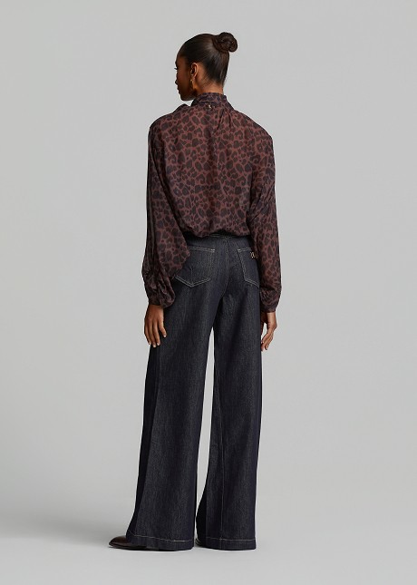 Oversized sheer leopard-print top with a tie-neck
