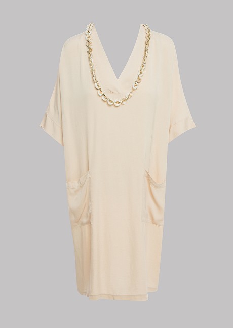 Dress with decorative necklace