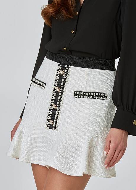 Mini tweed skirt with ruffles and pearls