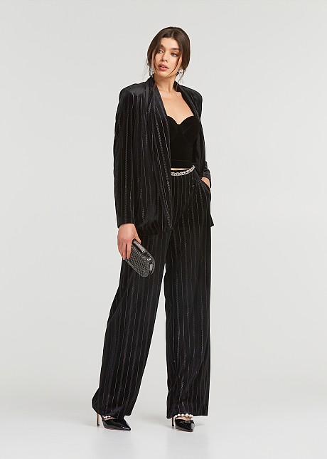 Pants in velvet look with strass stripes