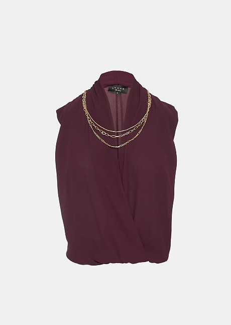 Sleeveless blouse with decorative necklace