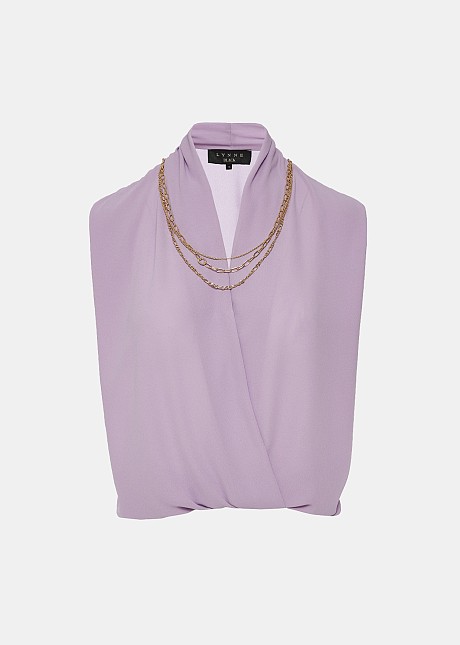 Sleeveless blouse with decorative necklace