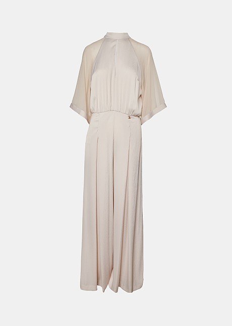 Jumpsuit with mesh fabric on the sleeves