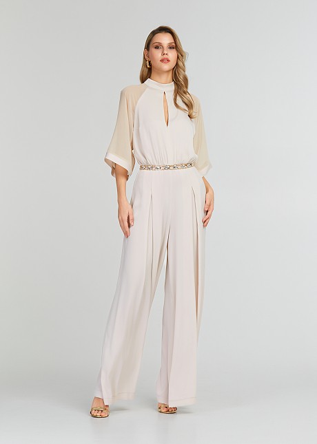 Jumpsuit with mesh fabric on the sleeves