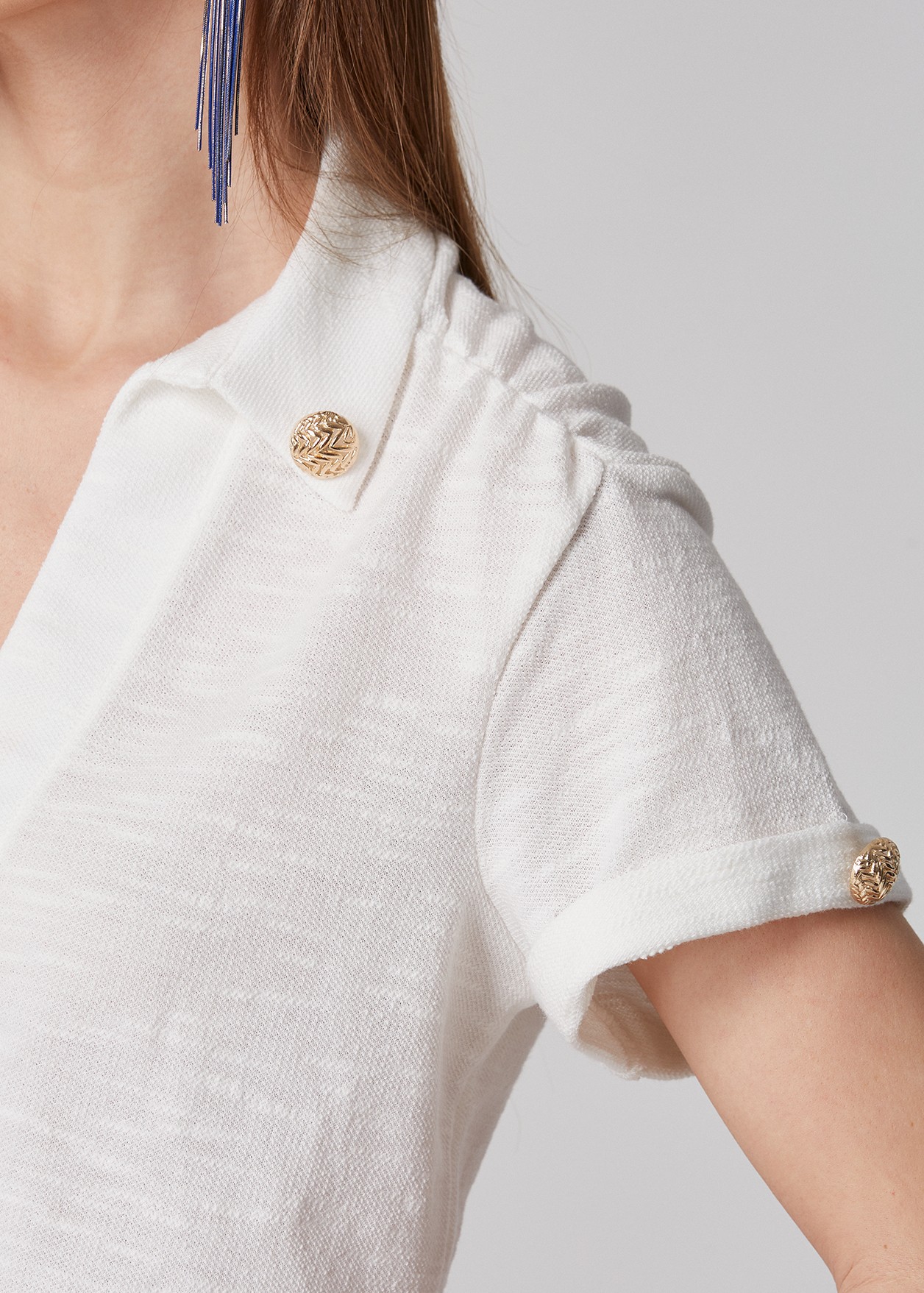 Short sleeve blouse with gold shaded buttons
