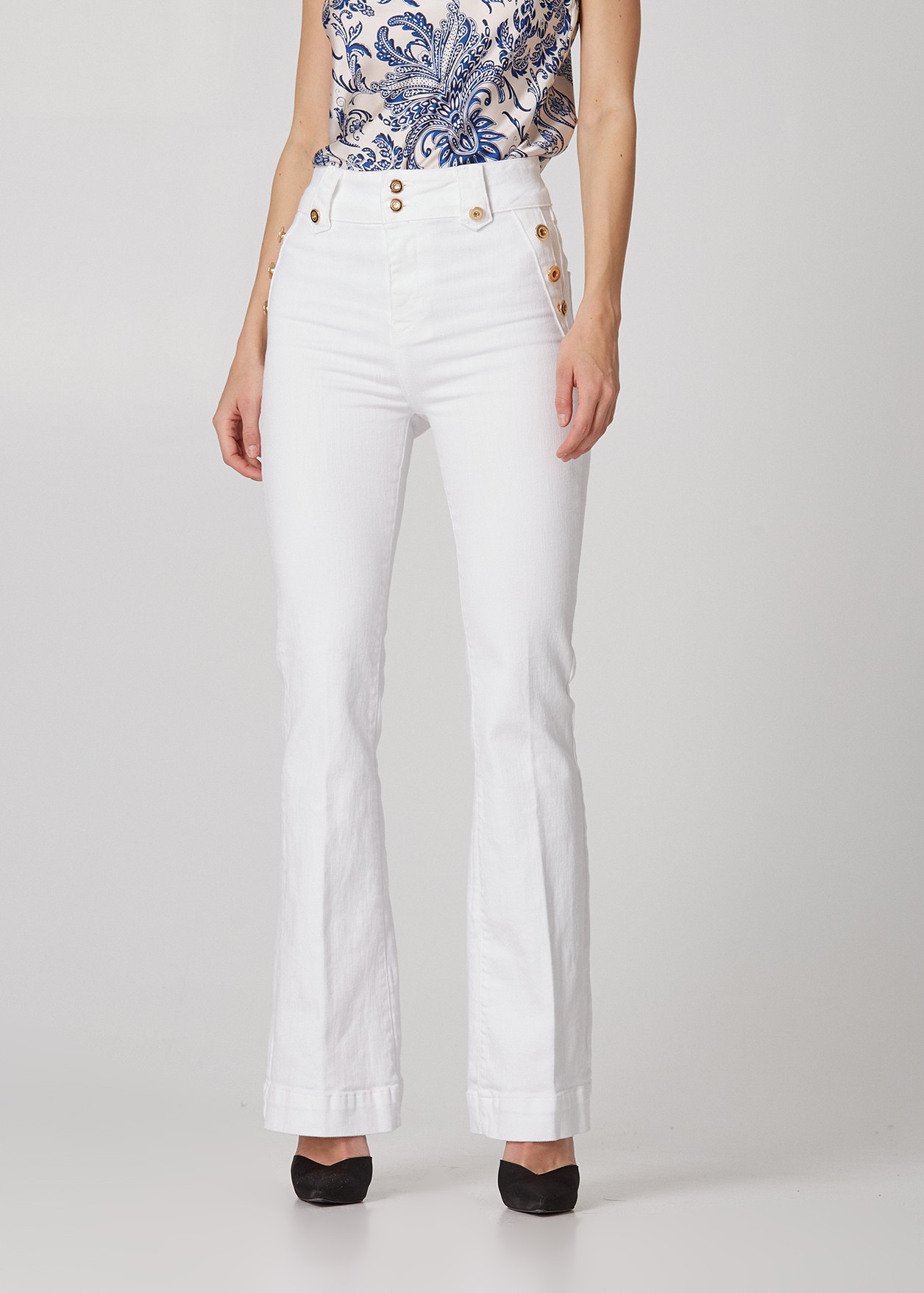 Denim flared trousers with decorative buttons