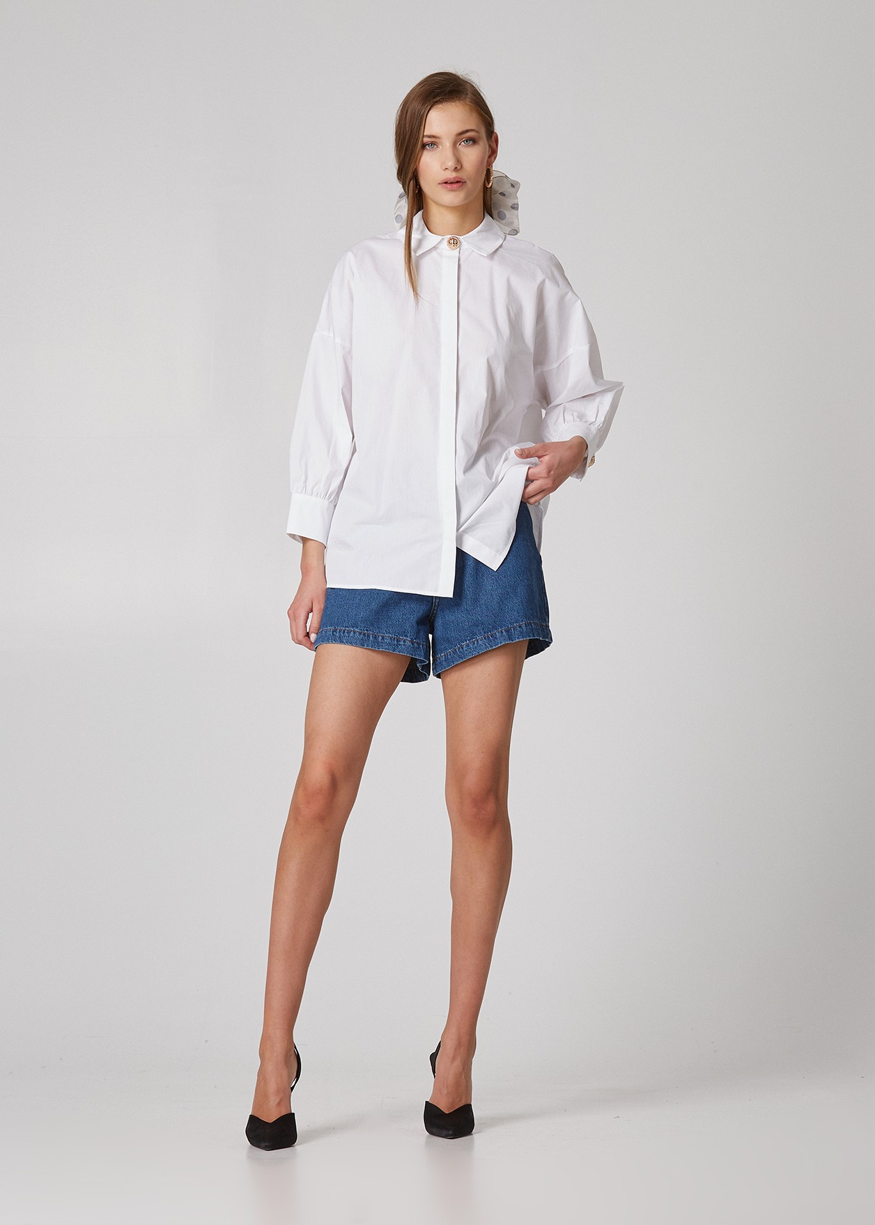 Oversized shirt with decorative buttons