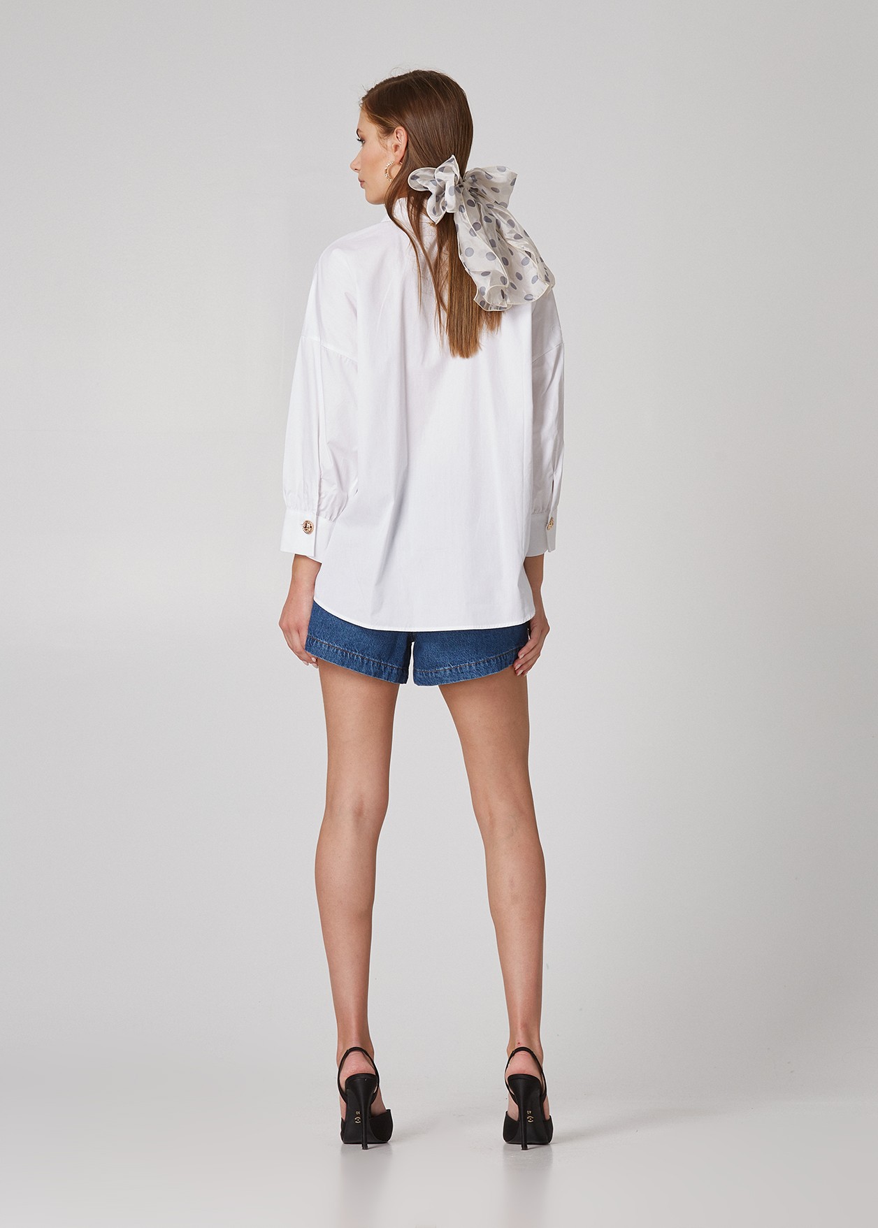Oversized shirt with decorative buttons
