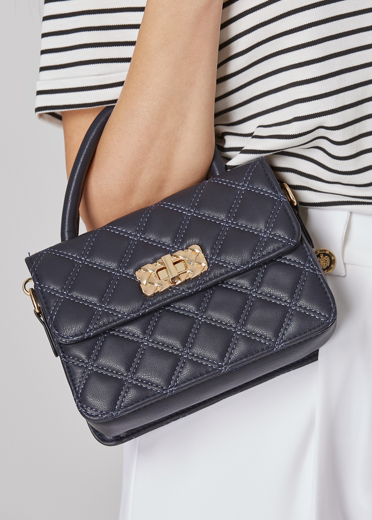 Quilted cross body bag with top handle