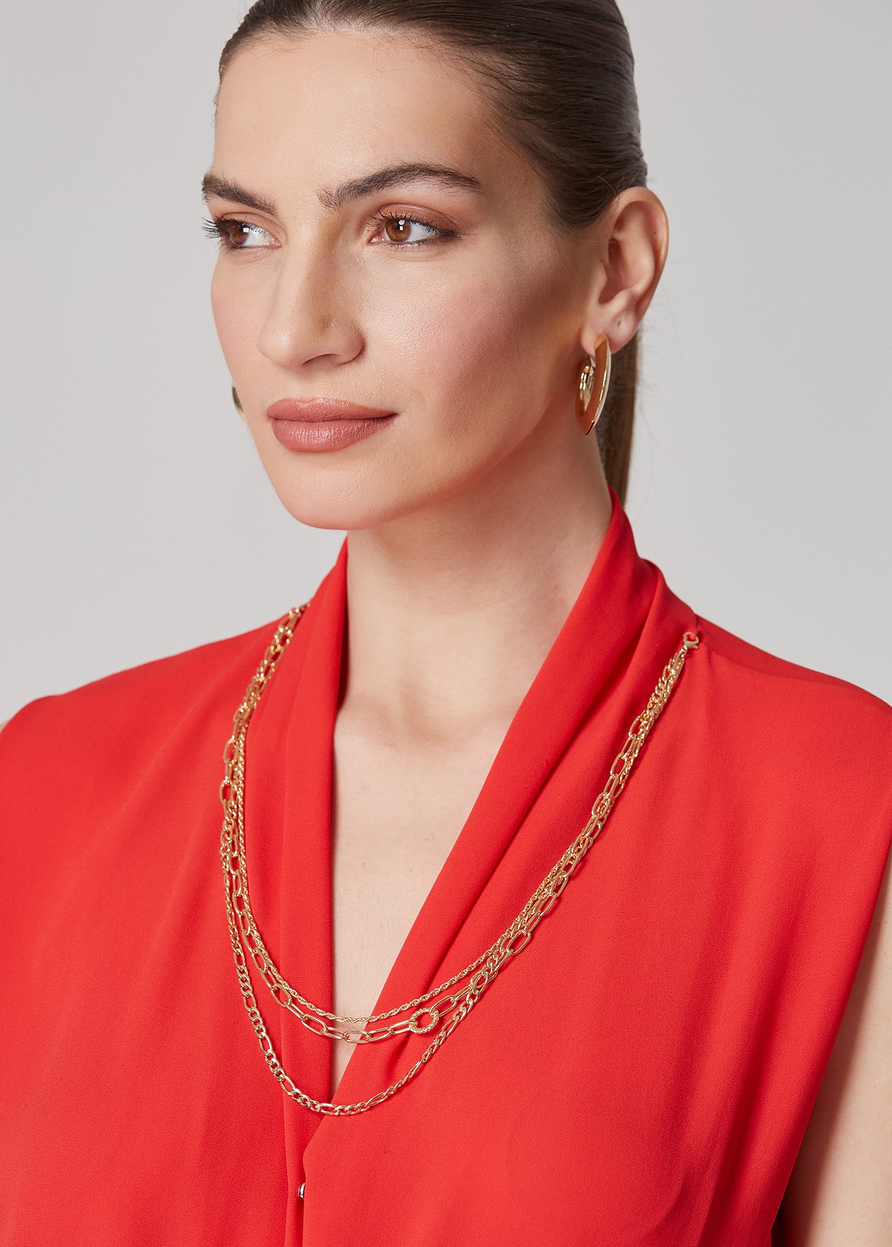Sleeveless blouse with decorative neckline