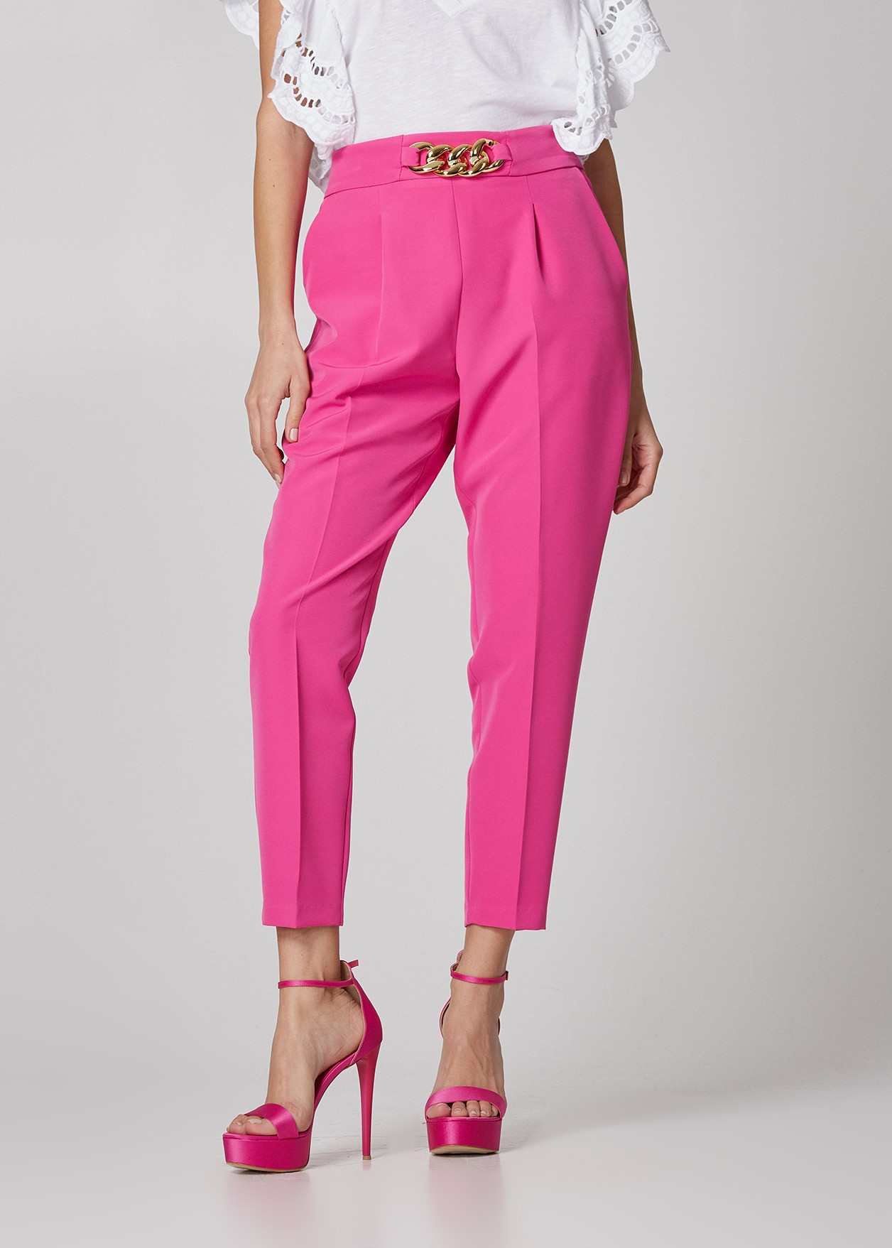 Trousers with metallic buckle
