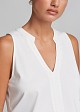 Top with a cut-out  and V neckline