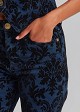 Flared jeans with an embossed velvet paisley print