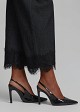 Trousers in soft denim and decorative lace hem