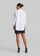 Fitted asymmetric shirt with peplum
