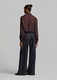 Oversized sheer leopard-print top with a tie-neck